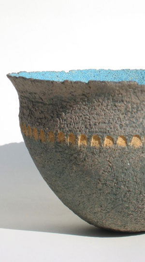 Ochre-impressed blue yellow bowl